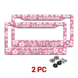 Personalized Pink Cherry Blossom license plate frames in a 2-piece pack with mounting hardware