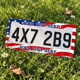 Personalized American Flag license plate frame displayed on a plate outdoors