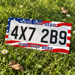 Personalized American Flag license plate frame displayed on a plate outdoors