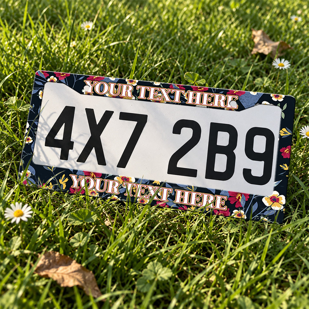 Personalized Dark Botanical Flowers license plate frame displayed on a plate outdoors