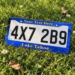 Personalized Lake Tahoe license plate frame displayed on a plate outdoors