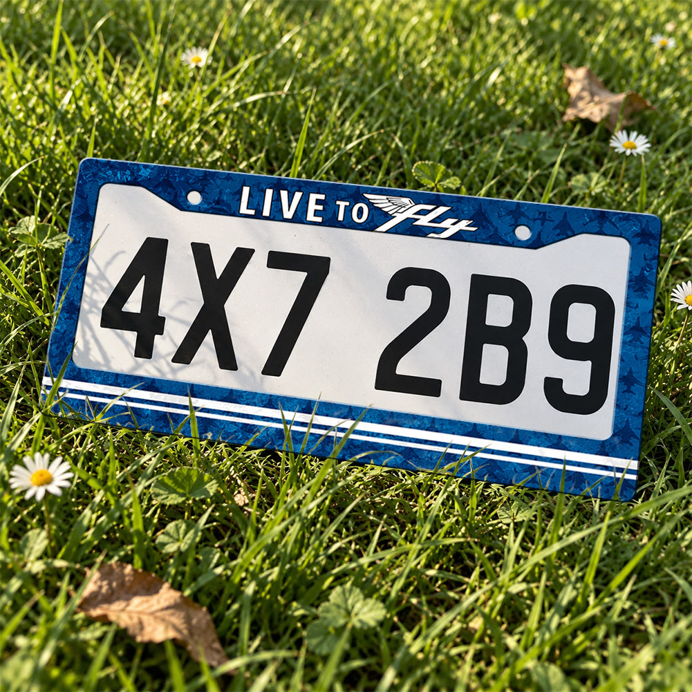 Live to Fly Aviation license plate frame displayed on a plate outdoors