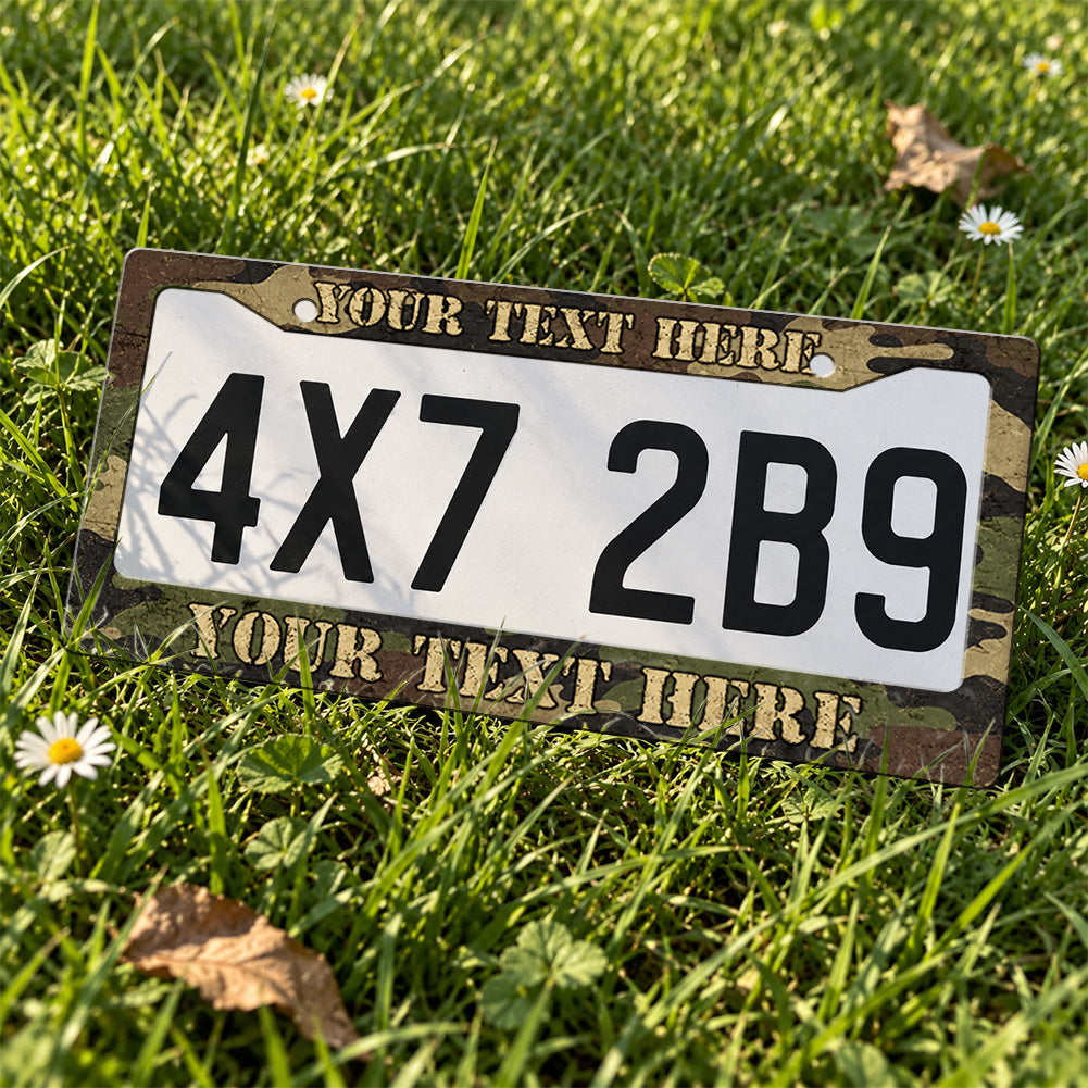 Personalized Woodland Camouflage license plate frame displayed on a plate outdoors