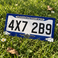 Aviation Nation Vintage Propeller license plate frame displayed on a plate outdoors