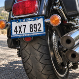 Personalized Live to Fly Aviation license plate frame installed on a motorcycle