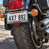 Personalized Black and White Checkered Racing license plate frame installed on a motorcycle