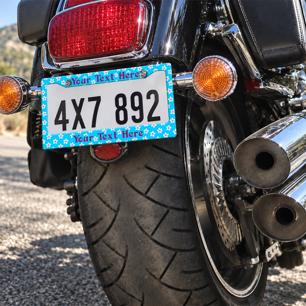 Personalized Turquoise Tropical Flowers license plate frame installed on a motorcycle