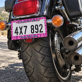 Personalized Pink Leopard Print license plate frame installed on a motorcycle