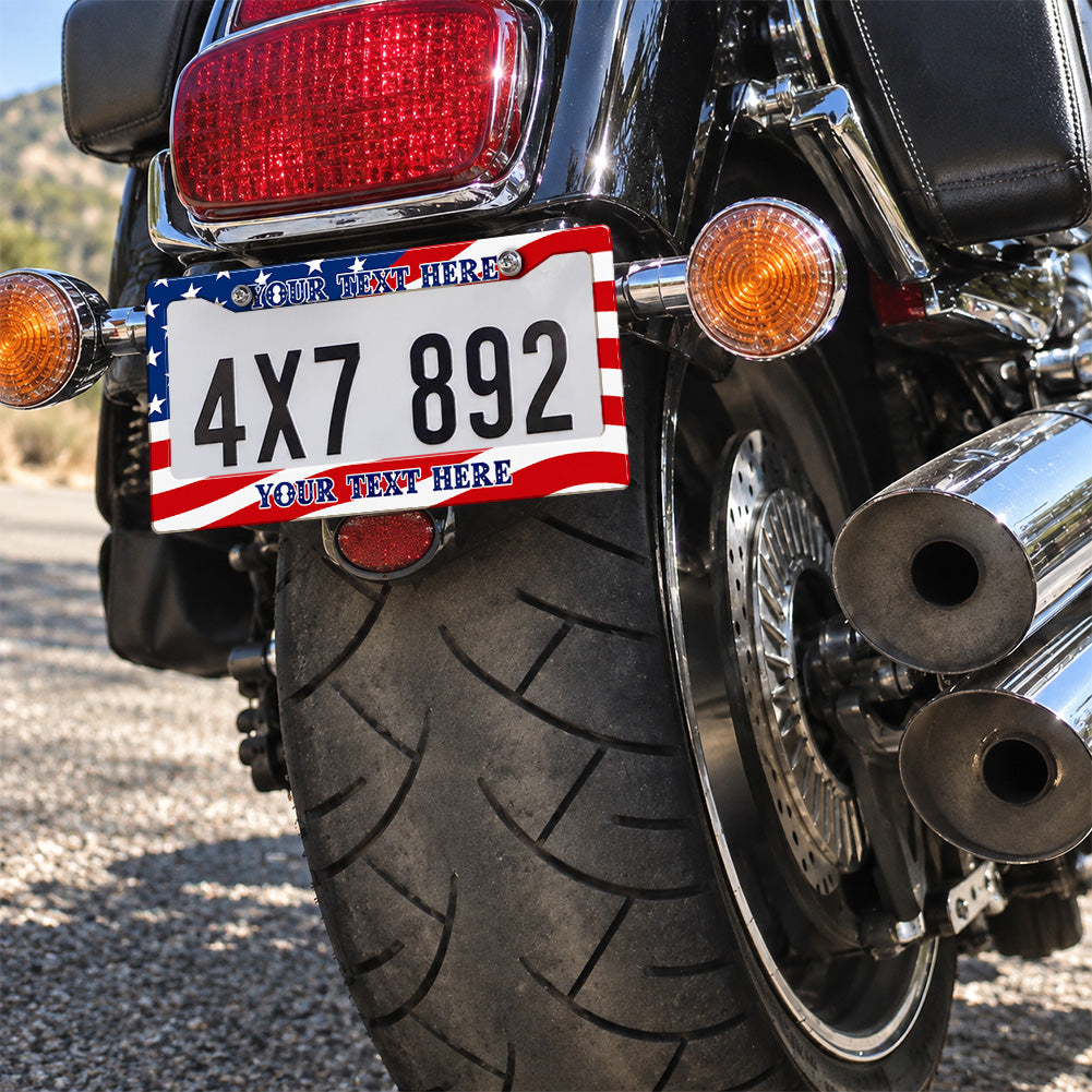 Personalized American Flag license plate frame installed on a motorcycle