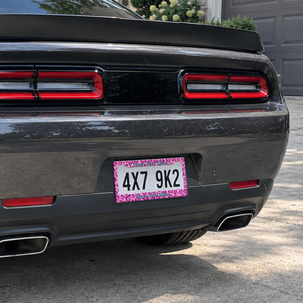 Pink Leopard Print license plate frame installed on a black sports car