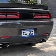 Lake Tahoe license plate frame installed on a black sports car