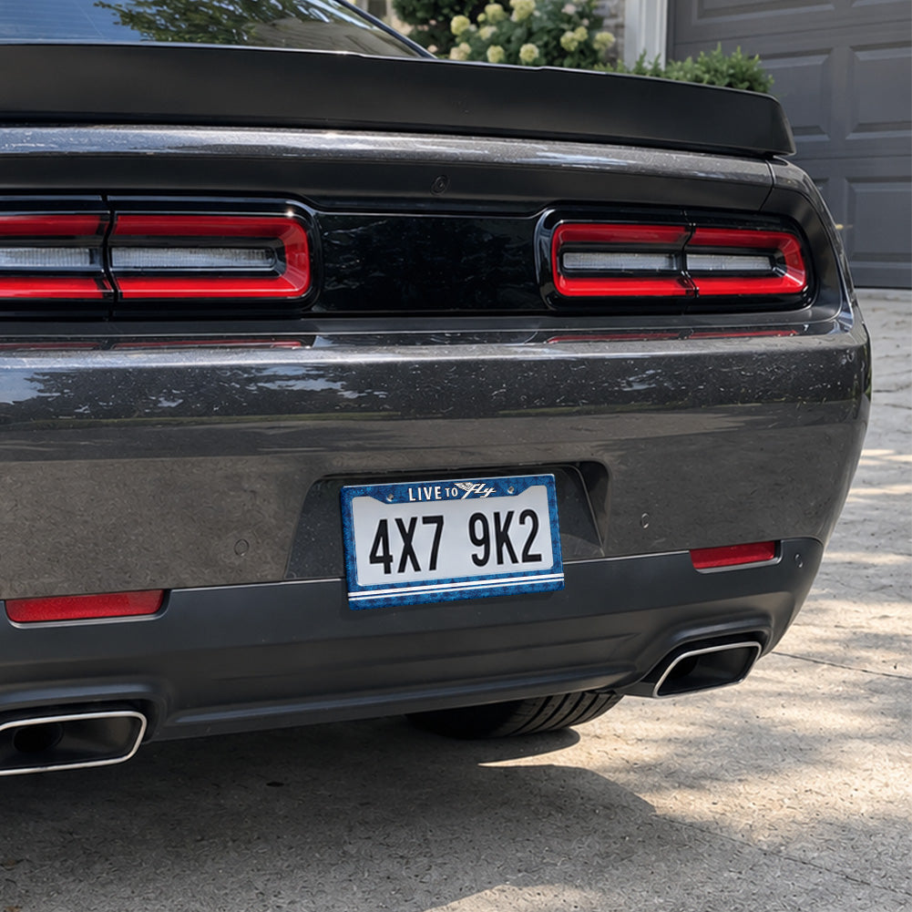 Live to Fly Aviation license plate frame installed on a black sports car