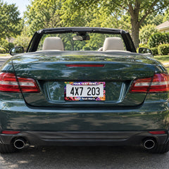Personalized Space Cats and Food license plate frame installed on a green convertible