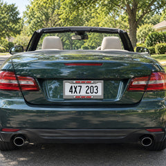Personalized Black and White Checkered Racing license plate frame installed on a green convertible