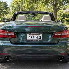 Personalized Carbon Fiber Racing license plate frame installed on a green convertible