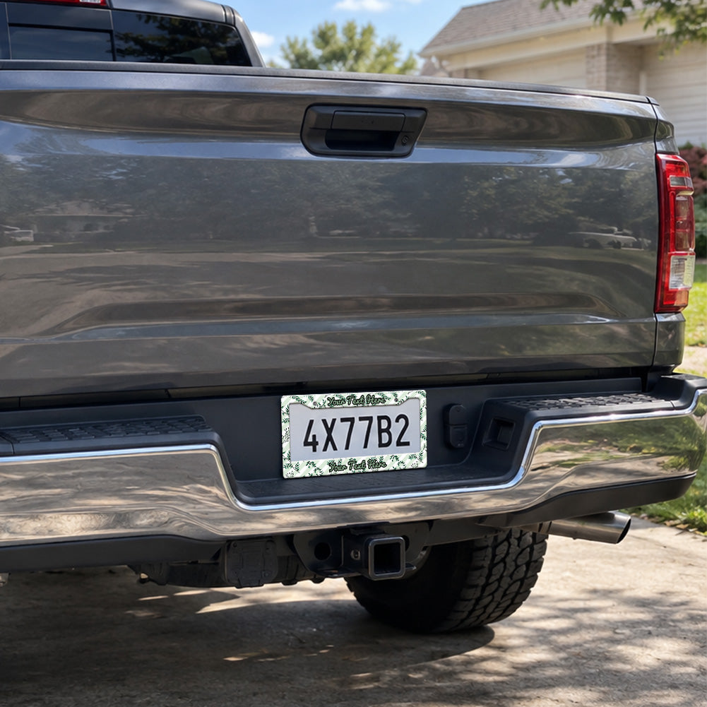 Green Botanical Leaves license plate frame installed on a pickup truck