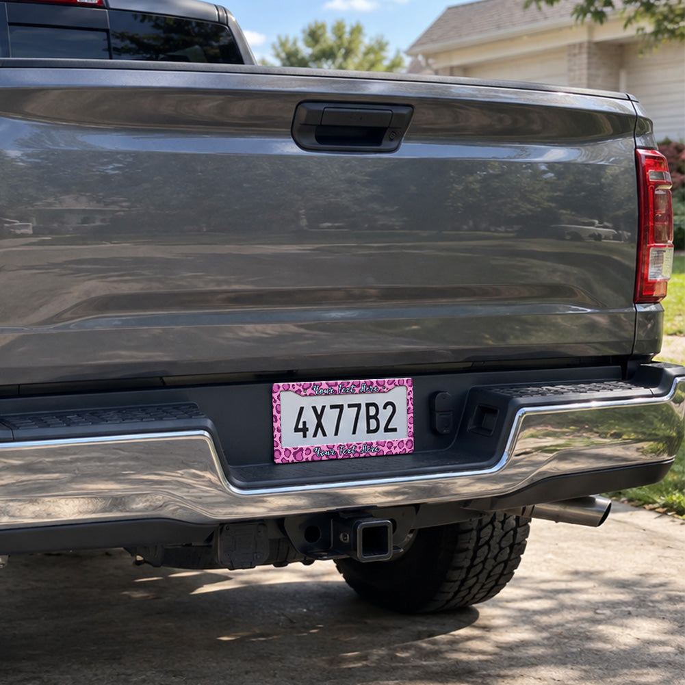 Custom Pink Leopard Print license plate frame installed on a pickup truck