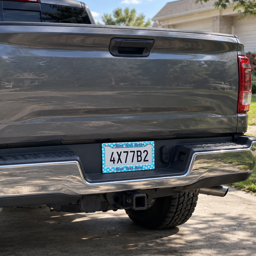 Turquoise Tropical Flowers license plate frame installed on a pickup truck