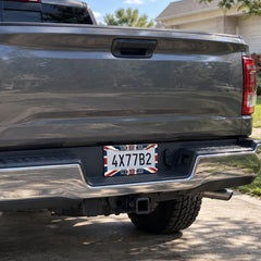 Custom Union Jack license plate frame installed on a pickup truck